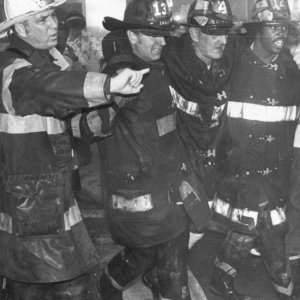 FDNY Chaplin Al. Thompson & Brother help injured Brother.jpg