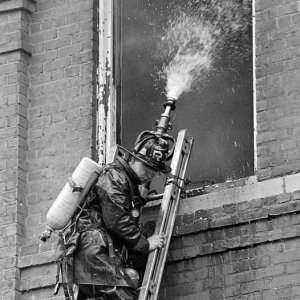 Boston FD R-1 Member with Ladder Pipe on Portable Ladder OR NOT.jpg